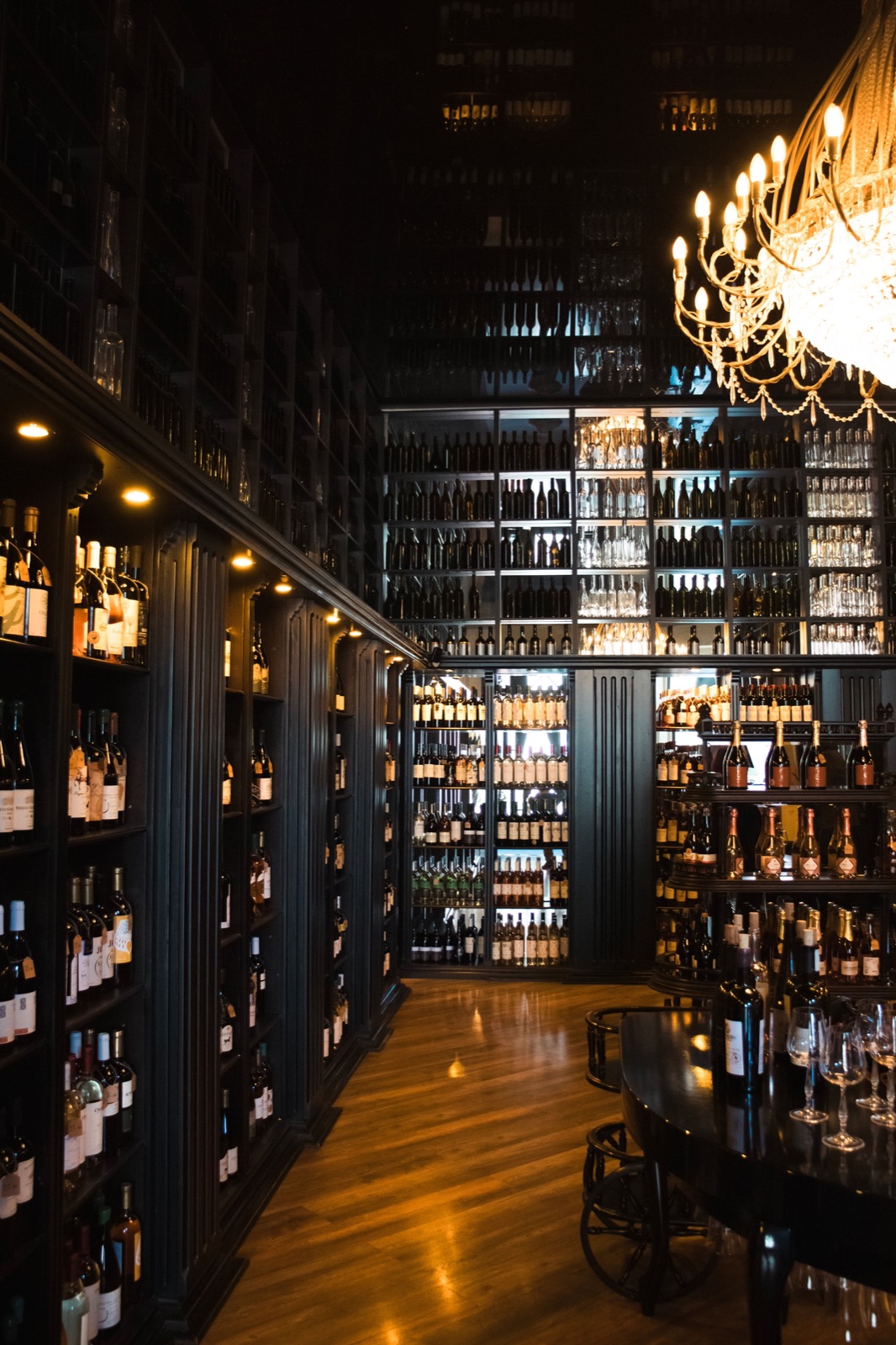 A dark cellar lined with bottles.